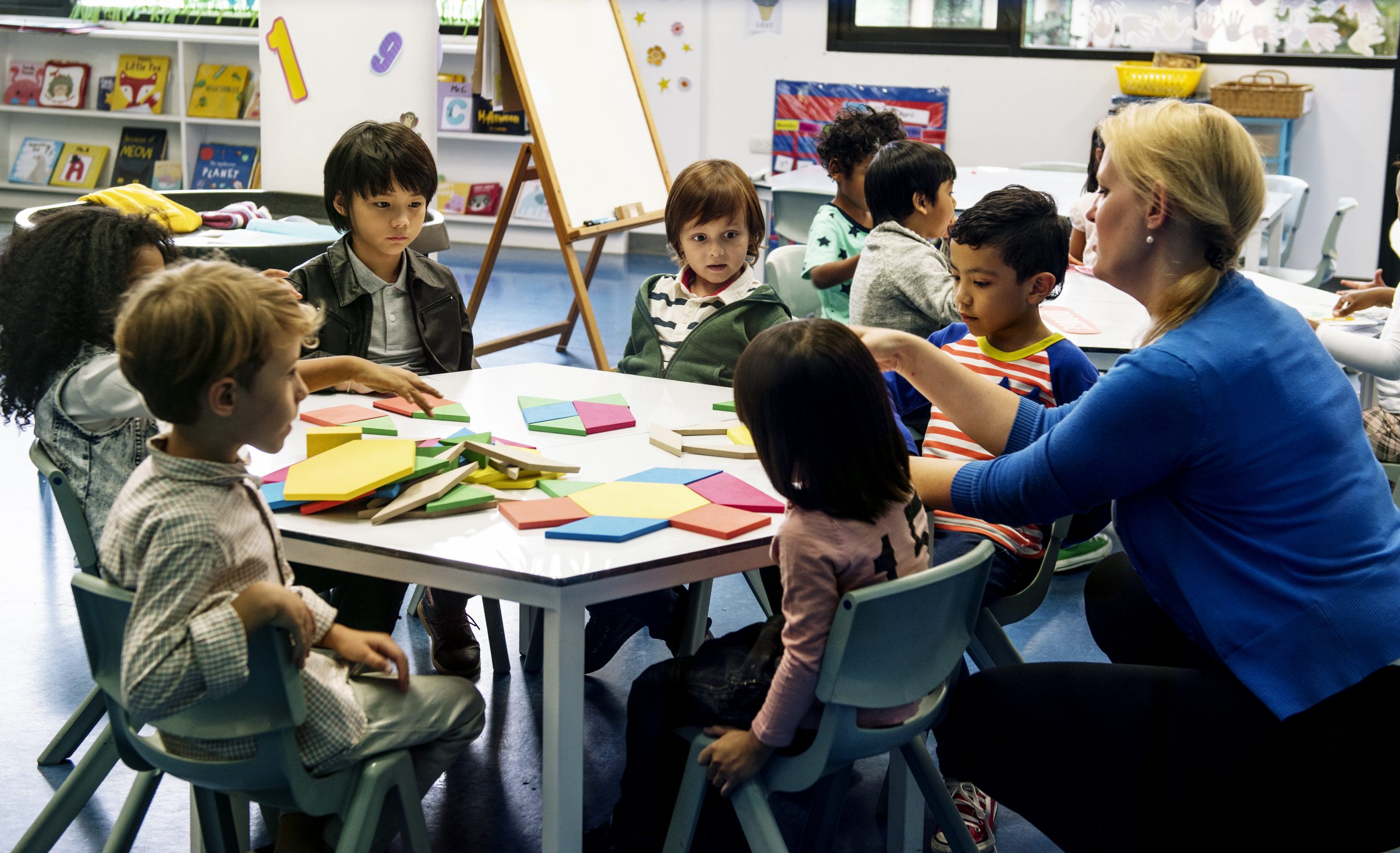 Group of diverse students at daycare child care classroom